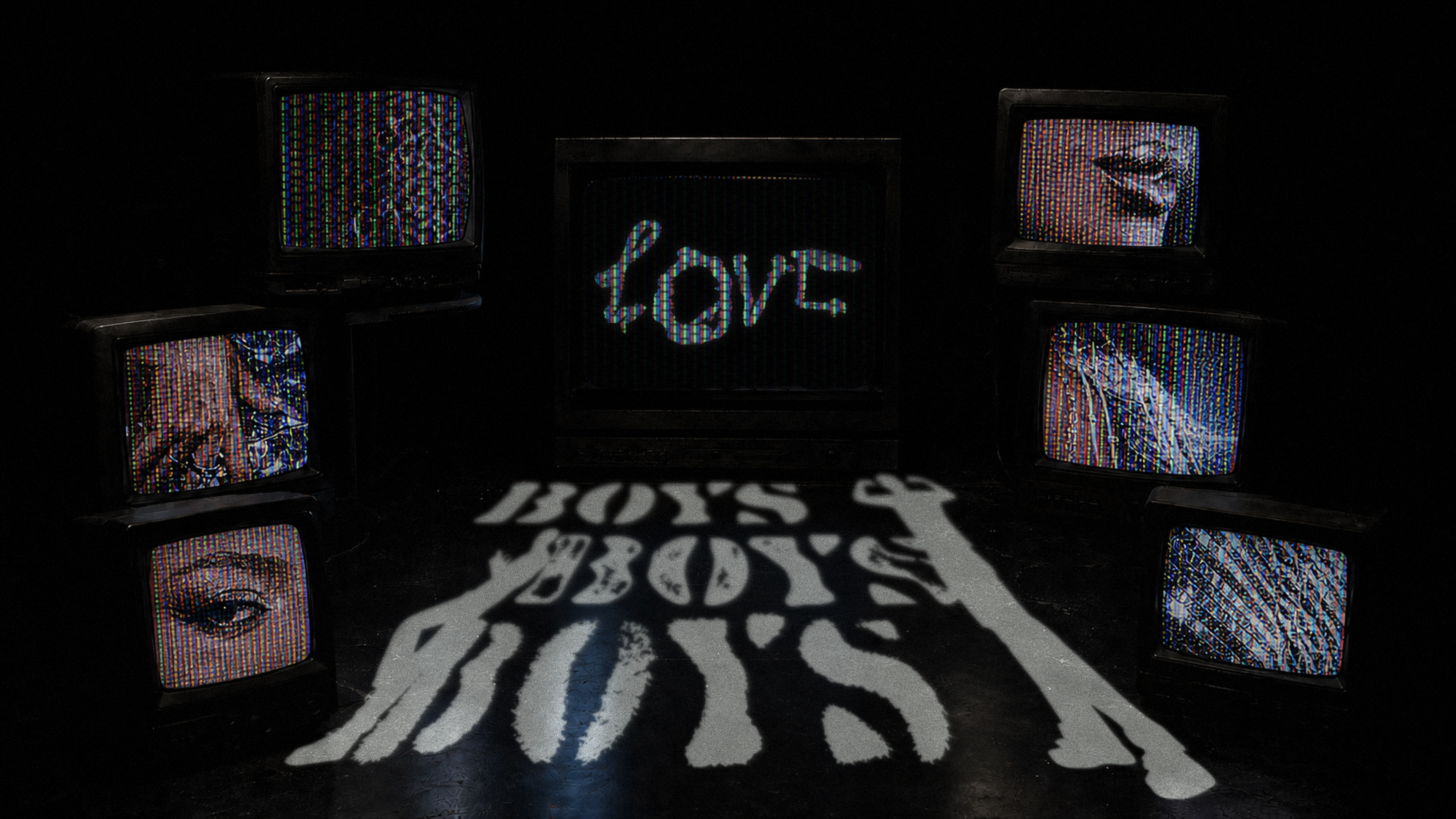 BOYS e LOVE ambientados em uma cena de televisores
